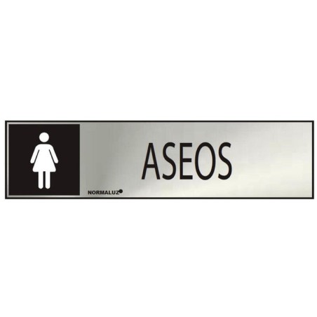 Cartel informativo "aseos" mujer (inox adhesivo 0.8mm) 5x20cm normaluz
